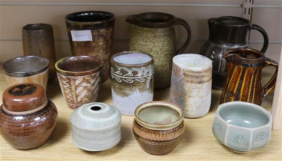 A group of studio pottery jugs and beakers